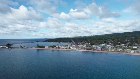 Drone aerial view over lake superior of Grand Marais in the summer alt