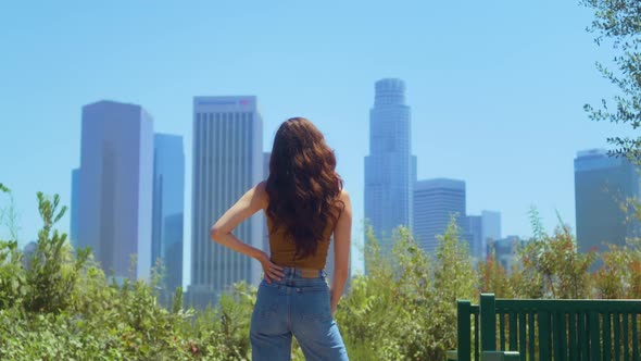 Unknown Brunette Looking Blurred Cityscape alt