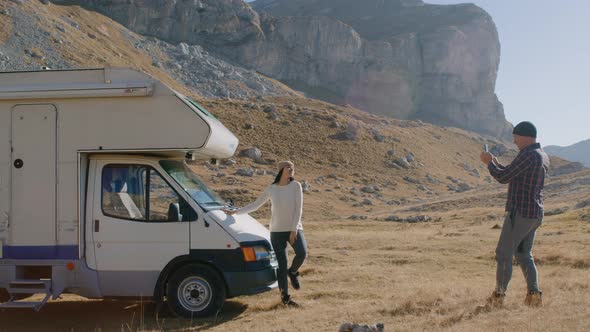Couple Take Photo By Motorhome Man Take Picture of Woman Stand Pose Near RV alt