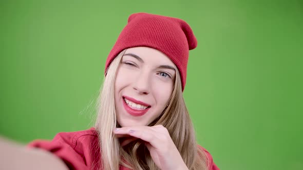 Girl Makes Selfie with Different Emotions. Green Screen. Close Up. Slow Motion alt