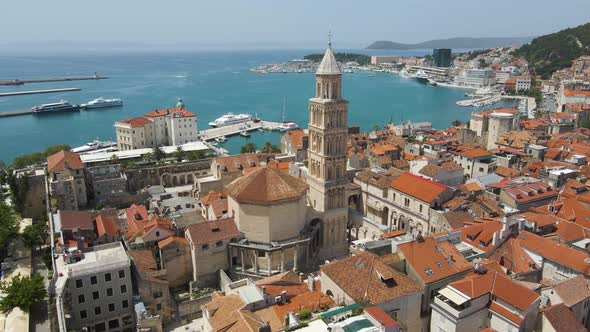 Aerial drone rotating shot over a popular tourist destination in Saint Domnius Cathedral and Dioclet alt