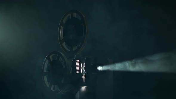 Vintage Projector Turns Film in Smoky Dark Studio. Projection Rays ...