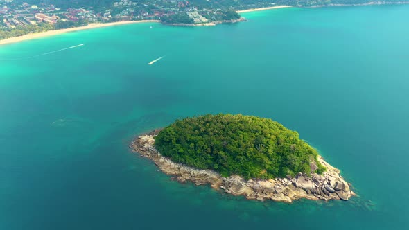 Nice rocks forested island, aerial panorama of Ko Pu against mountainous Phuket landscape on backgro alt