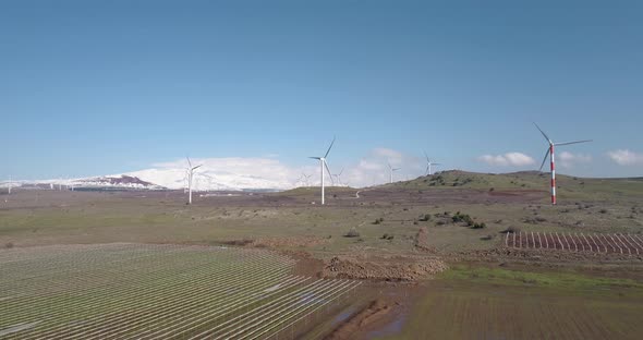 Aerial view of wind turbine farm near a vineyard, Golan Heights, Israel. alt