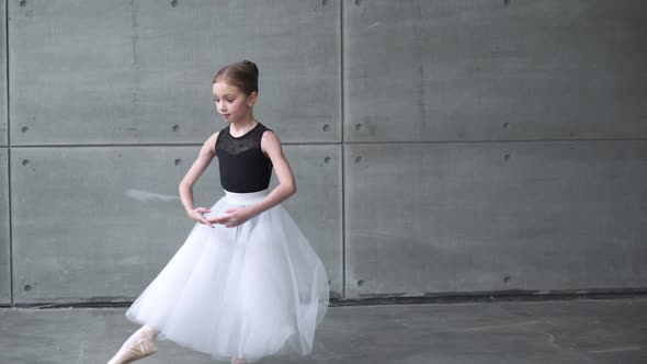 Elegant Little Girl in a Black and White Tutu Dress Dance Ballet and Perform Choreographic Elements alt