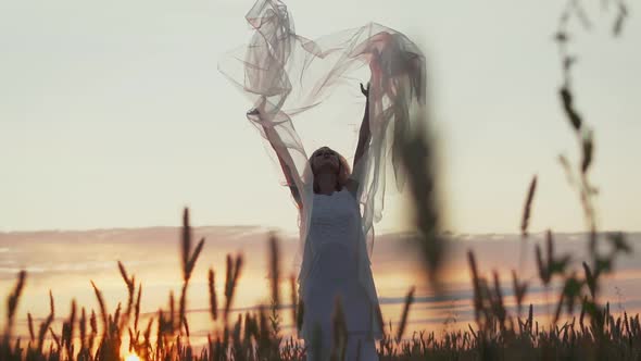Darkhaired Girl in White Clothes Dancing Oriental Dance