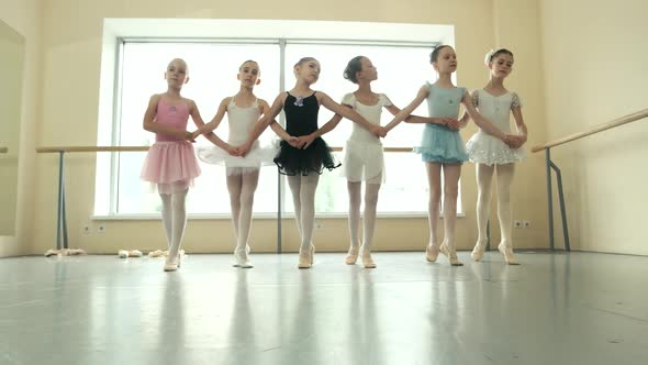 Group of Ballerinas Rehearsing Before Performance alt