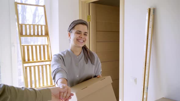 Guy Leads By Hand Joyful Girl Walking in New Apartment