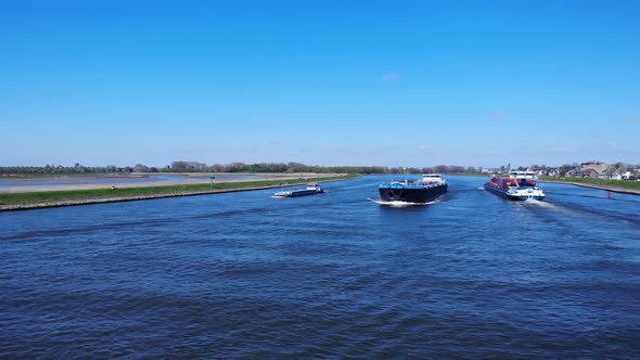 Shipping Vessels Meet At Noord River Loaded With Goods Near Hendrik-Ido-Ambacht, Netherlands. - aeri alt