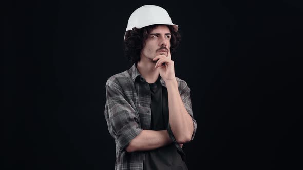 Social Hipster with Curly Hair Thinks Looks Right and Left Then Finds the Answer alt