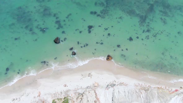 Top Down View Of Turquoise Sea In Aquinnah, Martha's Vineyard Island, Massachusetts - aerial drone s alt
