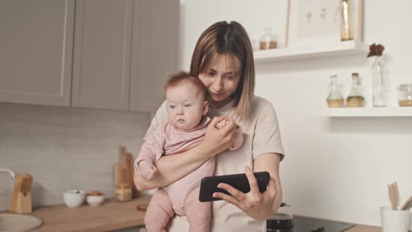 Woman with Infant Video Calling alt
