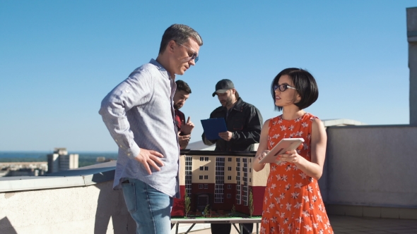 Designers Discussing and Shaking Hands alt