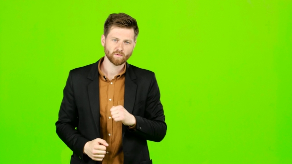 Man Is Standing in a Rack and Boxing. Green Screen alt