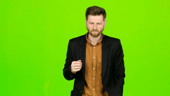 Man Is Suffering, His Head Hurts, He Is Tired. Green Screen alt