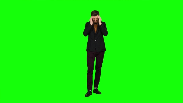 Guy Is Suffering, His Head Hurts, He Is Tired. Green Screen alt