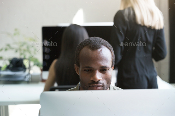 Concentrated afro american businessman working
