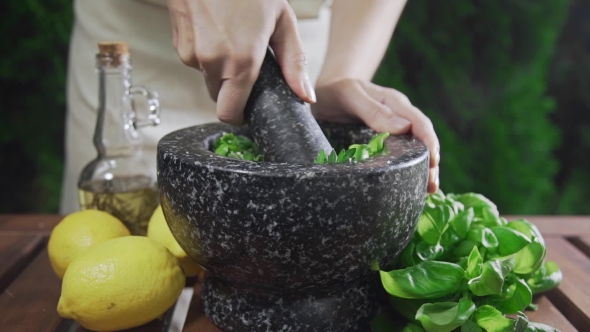 VideoHive Housewife Grinds the Basil for Pesto Sauce Outside Cooking Food Spicy Food Vegetarian Meal 20314807 VideoHive Housewife Grinds the Basil for Pesto Sauce Outside Cooking Food Spicy Food Vegetarian Meal 20314807