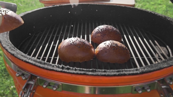 VideoHive Crispy Buns Are Roasting on the Grill in the Sunny Summer Day Cooking Food on the Open Fire the 20314818 VideoHive Crispy Buns Are Roasting on the Grill in the Sunny Summer Day Cooking Food on the Open Fire the 20314818