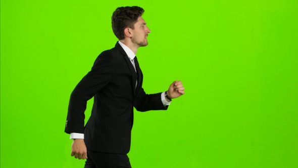 Businessman Is a Telephone Rings To Him and He Talks. Green Screen alt