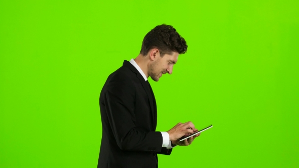 Businessman Is Going To Work and Prints Important Messages. Green Screen alt