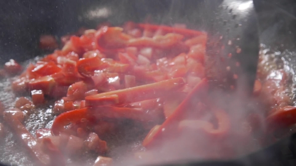 VideoHive Tomatoes and Peppers Are Frying in the Boiling Oil on the Open Fire Vegetable Ragout Grilling 20320880 VideoHive Tomatoes and Peppers Are Frying in the Boiling Oil on the Open Fire Vegetable Ragout Grilling 20320880