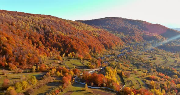 Aerial View of of the Small Village High Mountain in Morning Time with Beautiful Autumn Nature alt