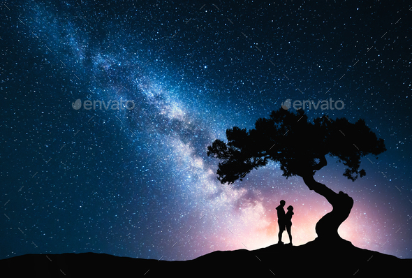 Milky Way with hugging couple under the tree