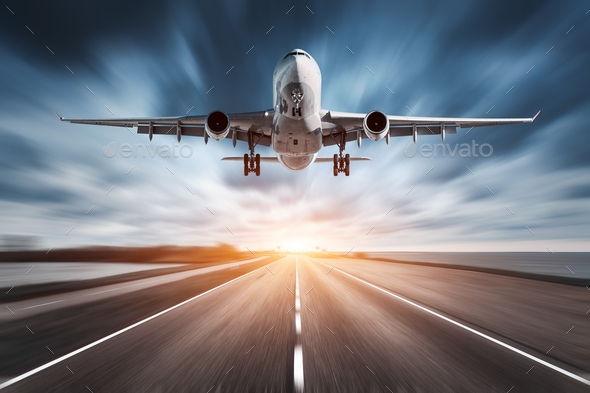 Airplane and road with motion blur effect at sunset.
