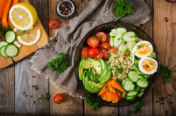 Bulgur porridge, egg and fresh vegetables - tomatoes, cucumber, celery and avocado