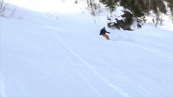 Snowboarder Carving in Powder