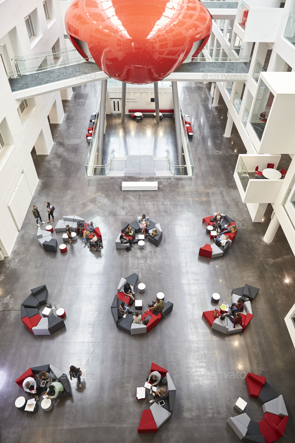 Seating in the atrium of modern university building, vertical - Stock Photo - Images