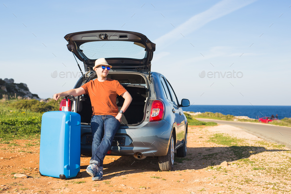 Summer, holiday, trip and vacation concept - Man near the car ready to travel