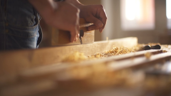 The Carpenter Sweeps the Shavings Off the Wood with Wood.