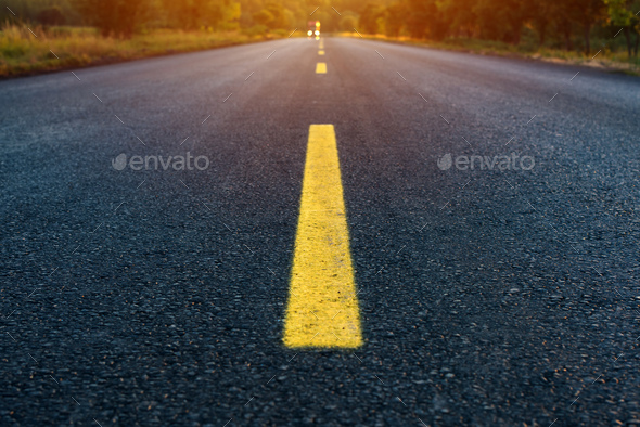 Yellow dashed line on empty asphalt road
