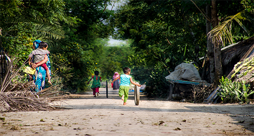 Happy children playing in the village road