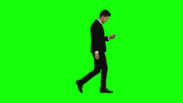 Businessman Is Going To Work and Prints Important Messages. Green Screen alt