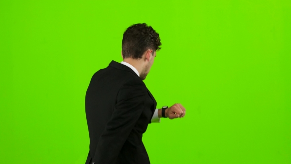 Businessman Is a Telephone Rings To Him and He Talks. Green Screen alt