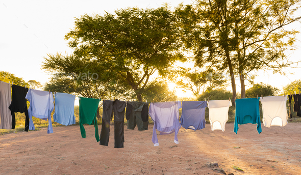Laundry Drying on Outdoor Clothes Line Stock Photo by THP-Creative
