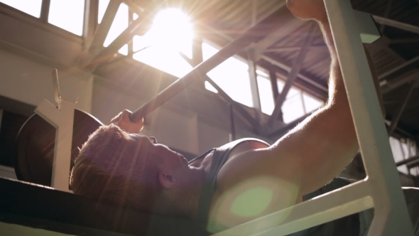 Man Doing Chest Press in Gym