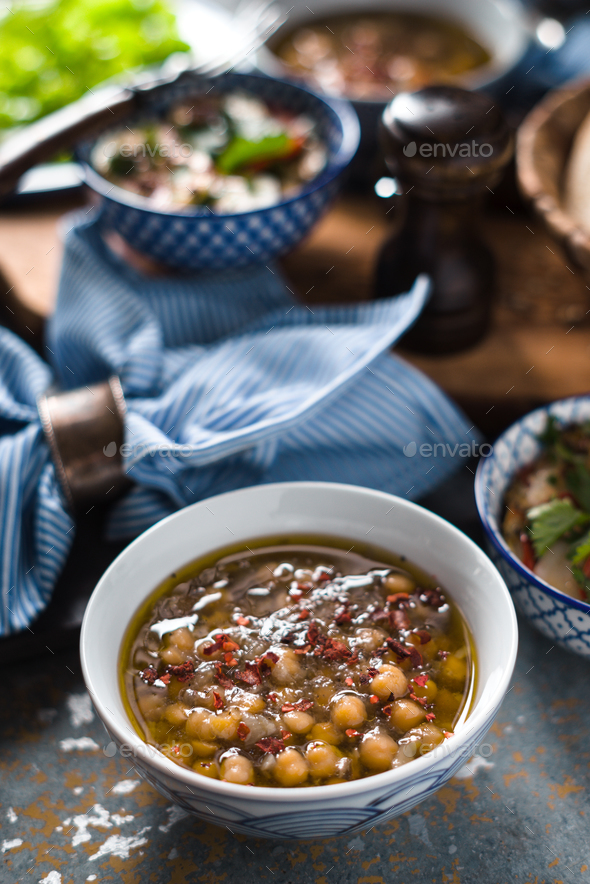 Greek chickpea soup Revithia on the stone background Stock Photo by ...