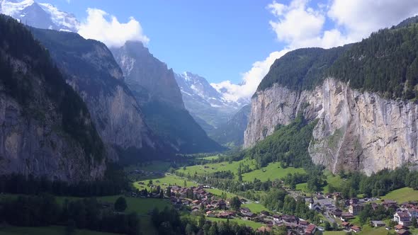 Aerial travel drone view of the Lauterbrunnen Valley and Staubbach Falls, Switzerland. alt