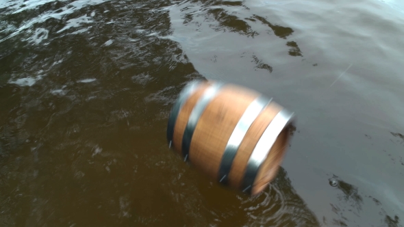 Barrel of Wood Floating on the Waves in the Sea alt