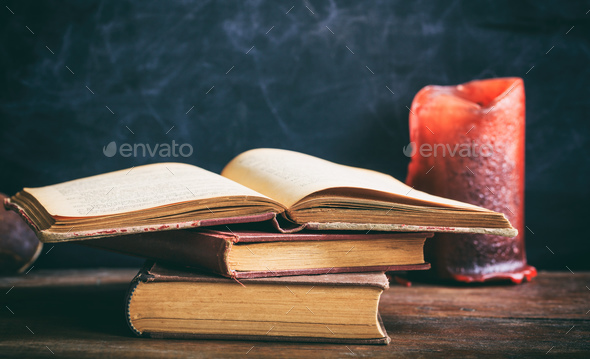 Vintage Books And Candle On Blackboard Background Stock Photo By Rawf8