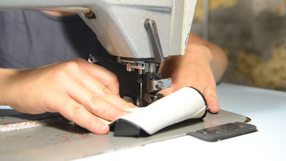 Shoemaker Repairing Shoes.  alt
