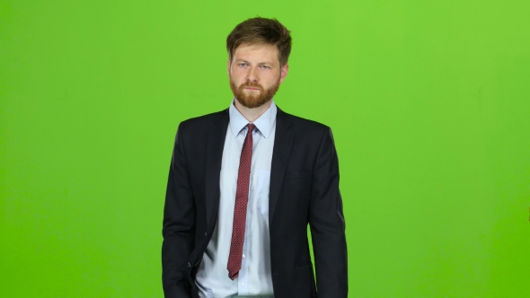 Guy Looks at the Photo on the Phone and Finds a List of Pictures. Green Screen alt