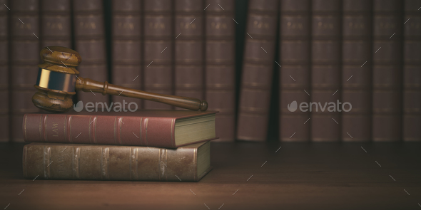 Gavel on the background of vintage lawyer books. Concept of law Stock Photo  by maxxyustas