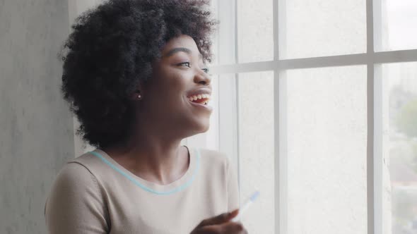 Happy Attractive Emotional African Young Lady Hold Pregnancy Test Great Surprised Positive Result alt