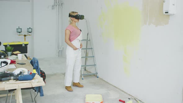 Excited Female Painter in Virtual Reality Goggles alt