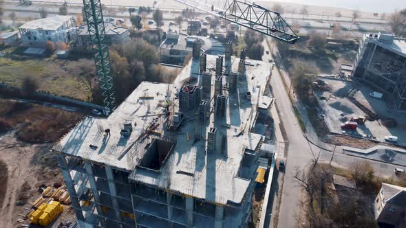 Workers on Construction site with crane. Group of construction engineer team alt